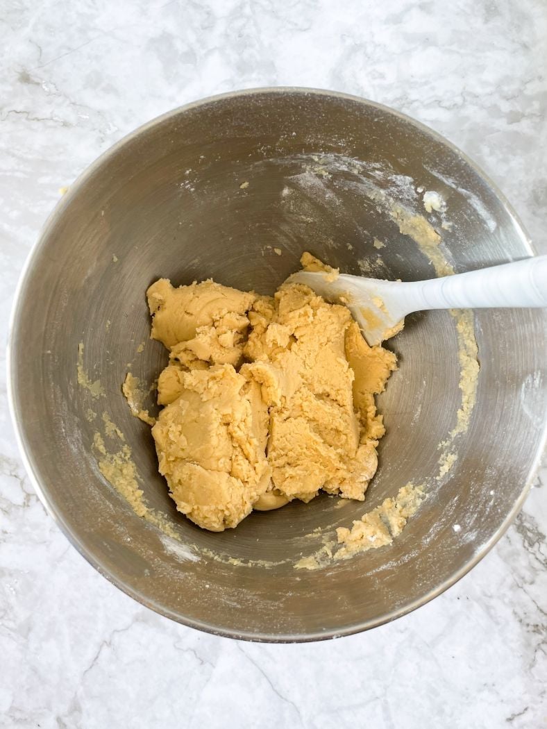 cookie dough is shown in a mixing bowl